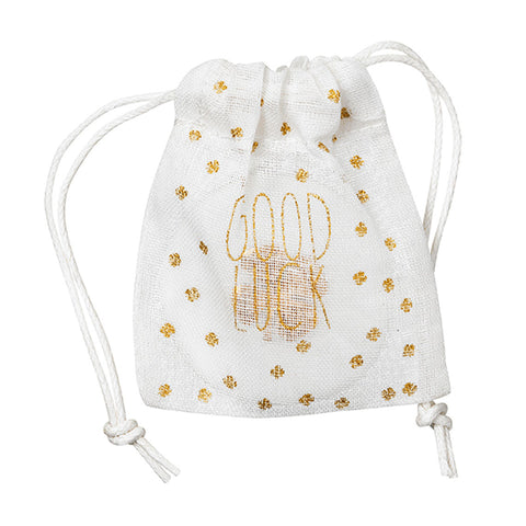 White drawstring bag with gold 'Good Luck' text and patterns on a white background