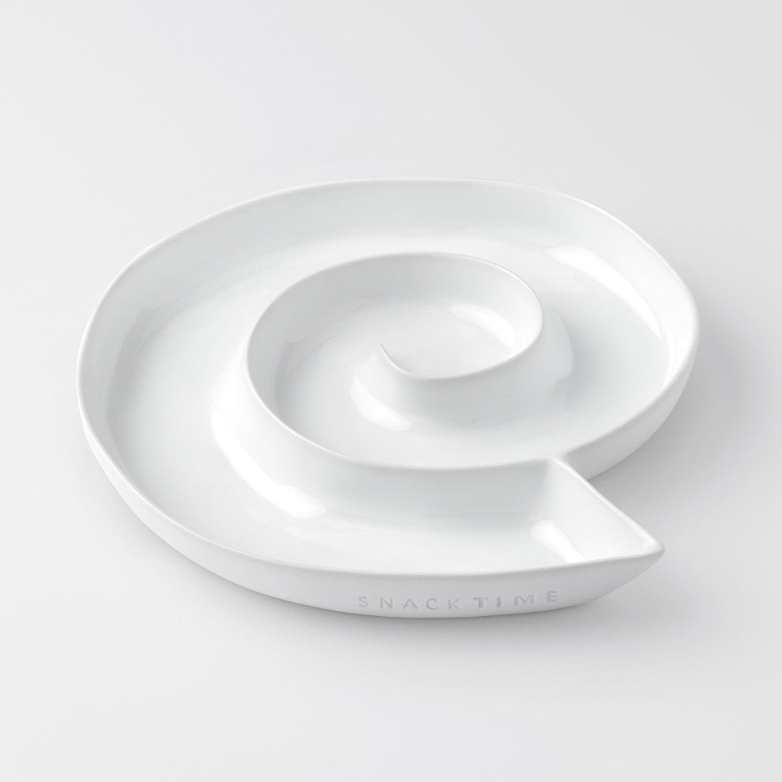 White porcelain dish with a lid on a light gray background