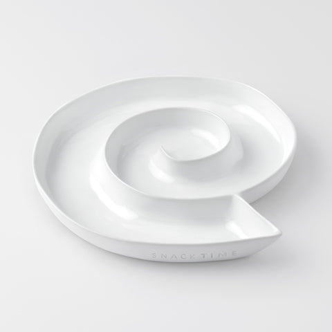 White porcelain dish with a lid on a light gray background