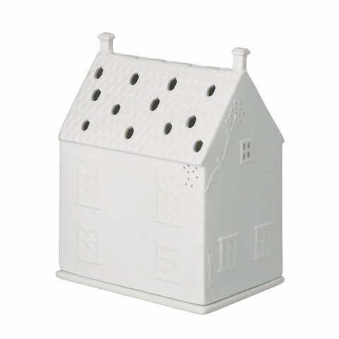 White porcelain house-shaped candle holder on a white background