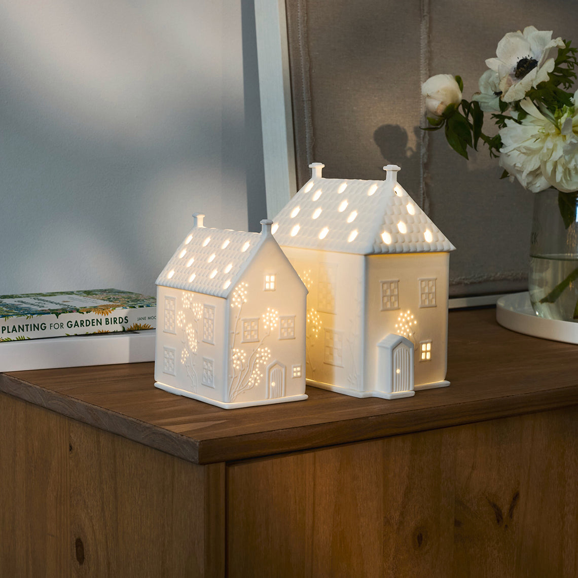 Cottage and Country House Porcelain Tealights on wood shelf.