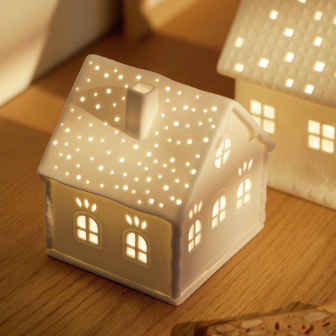 Village House winter Cottage Porcelain Tealight House with candy cane embossing with a tealight inside.