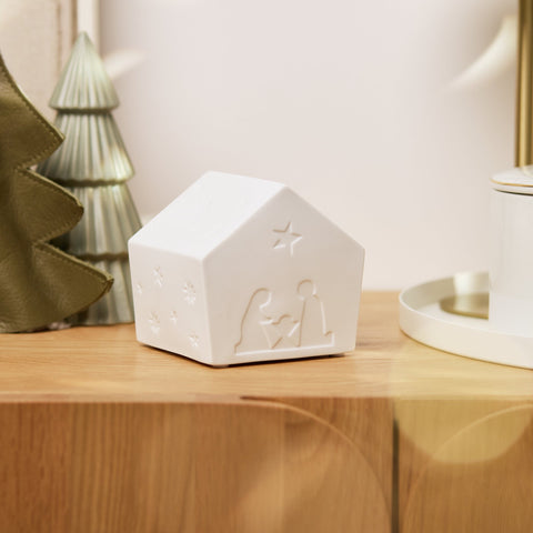 Porcleain LED Lamp Nativity House on wood shelf no illuminated. 